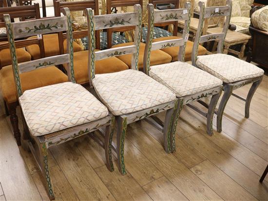 A set of four 19th century painted and decorated dining chairs